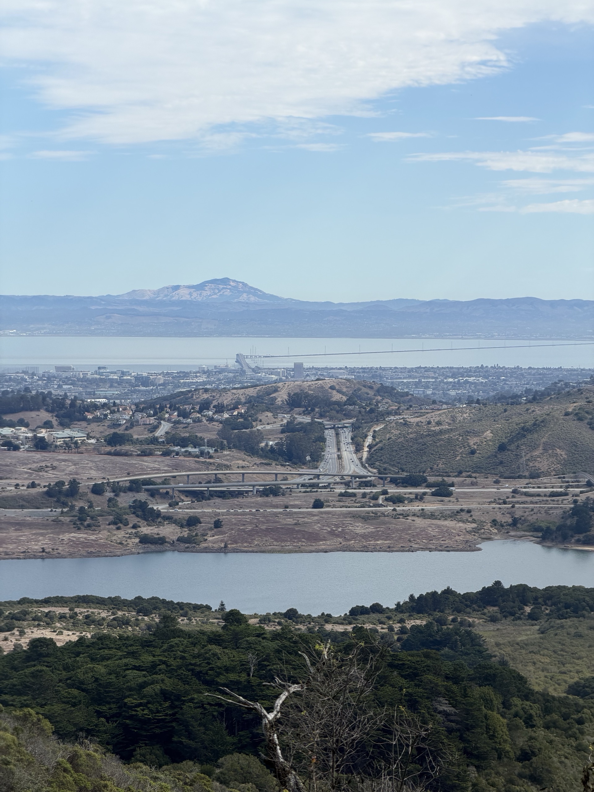 View from the Skyline watershed trail over a reservoir toward the bay and Mount Diablo